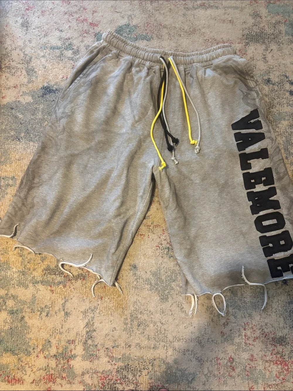 Gray Cutoff Sweatshorts with Black Logo and Yellow Drawcords